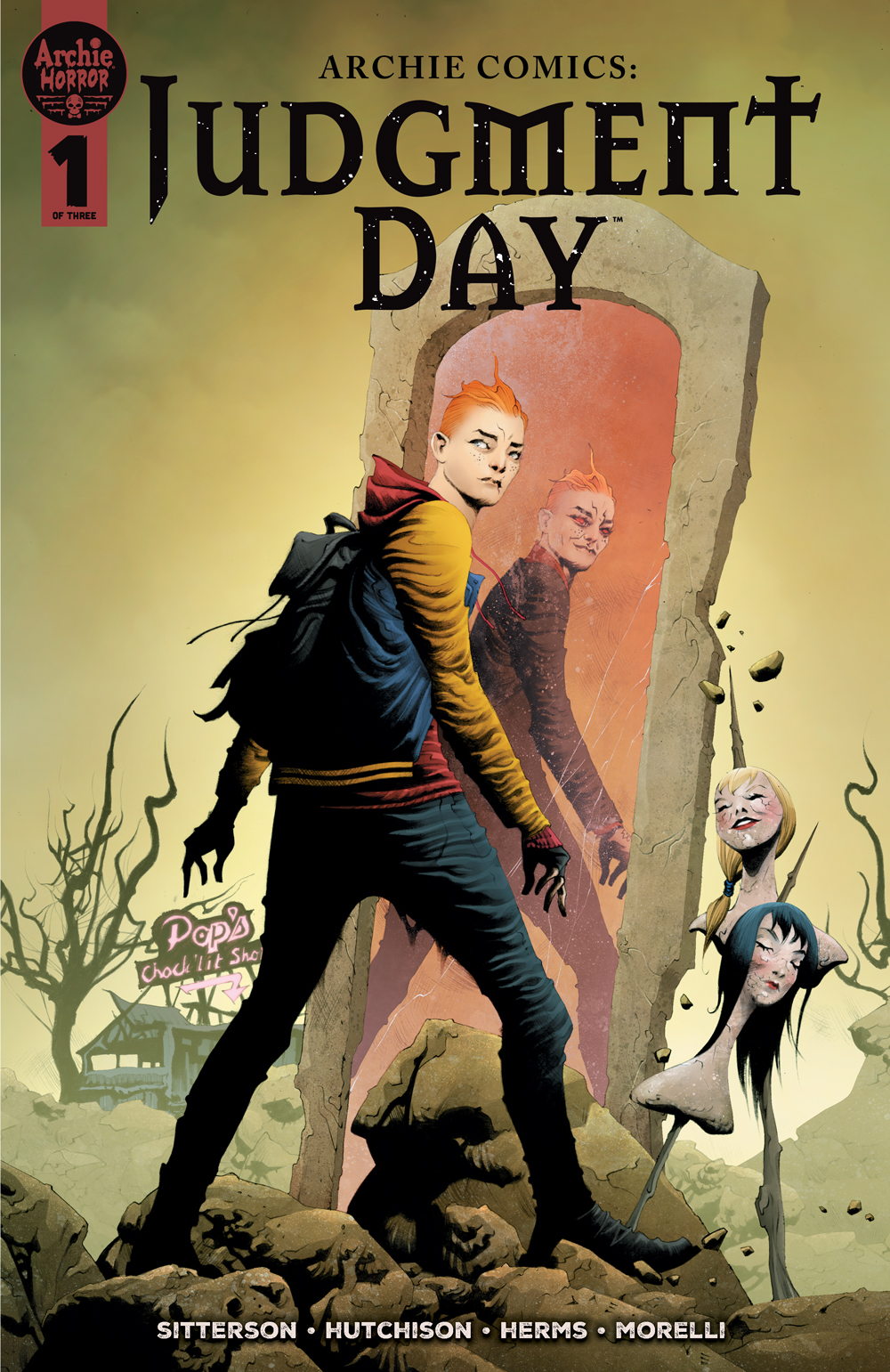 Archie Andrews walks through an eerie desolate landscape with severed heads on spikes. He walks by a mirror and his reflection looks darker and more sinister.