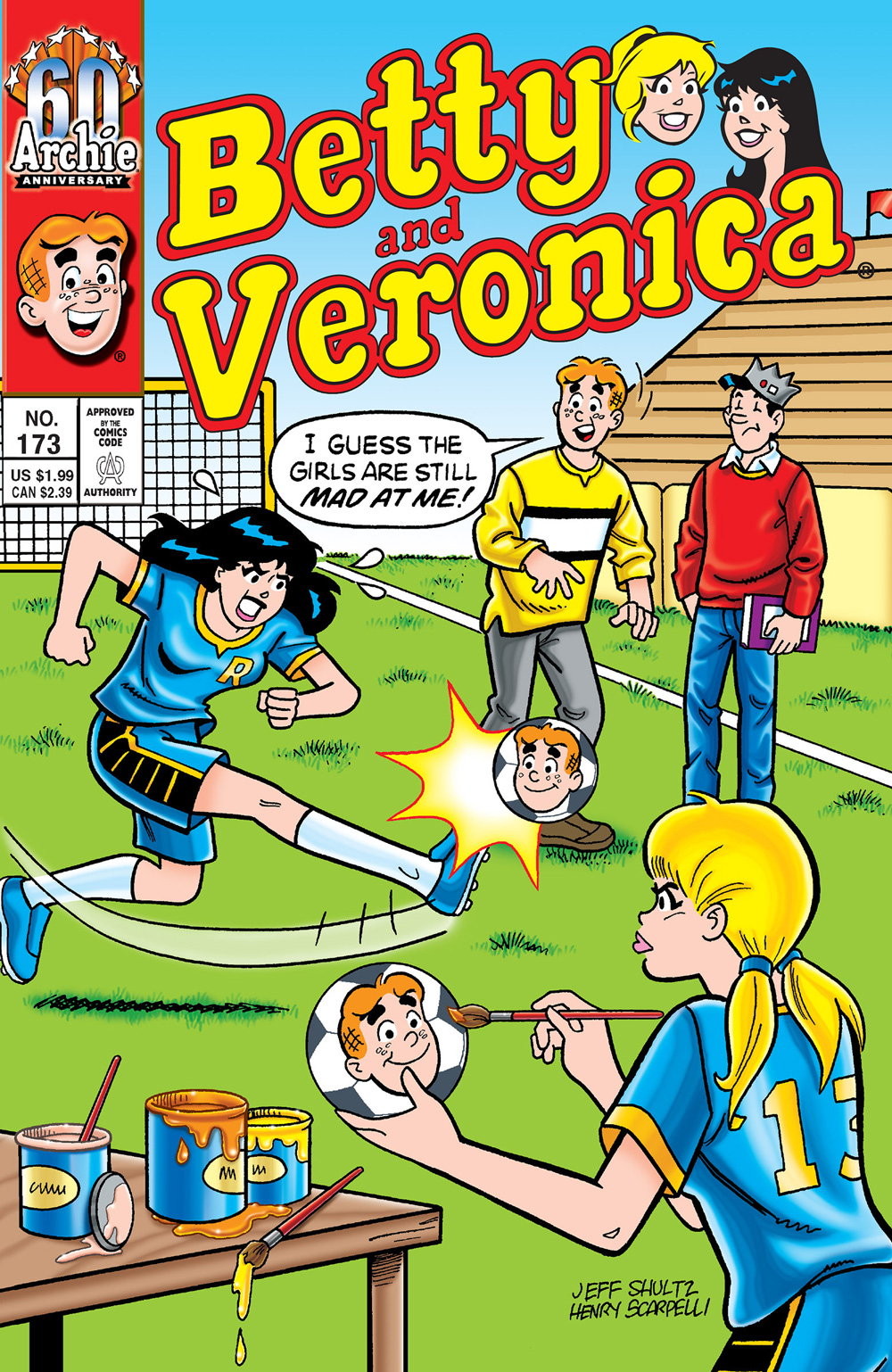 Betty and Veronica wear soccer uniforms on a soccer field, with angry facial expressions. Veronica is kicking a ball with Archie's face on it, while Betty paints another one with his face. Archie and Jughead stand off to the side and Archie says the girls are still mad at him.