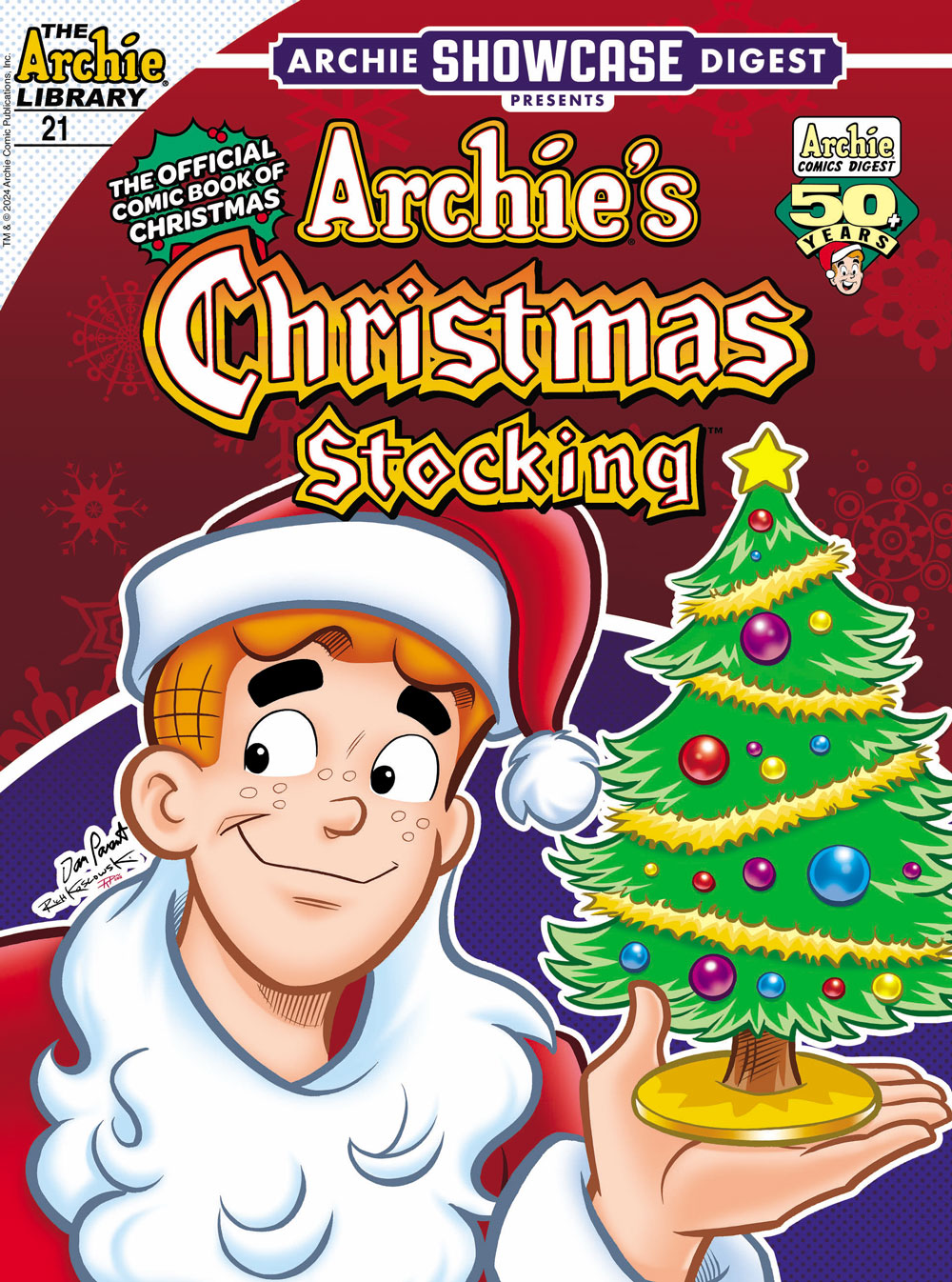 Cover of ARCHIE SHOWCASE DIGEST #21, subtitled ARCHIE'S CHRISTMAS STOCKING. Archie, wearing a Santa Claud costume, looks off to the site with a smile while holding a decorated Christmas tree in the palm of his hand. It's over a red background with stylized decorative snowflakes.