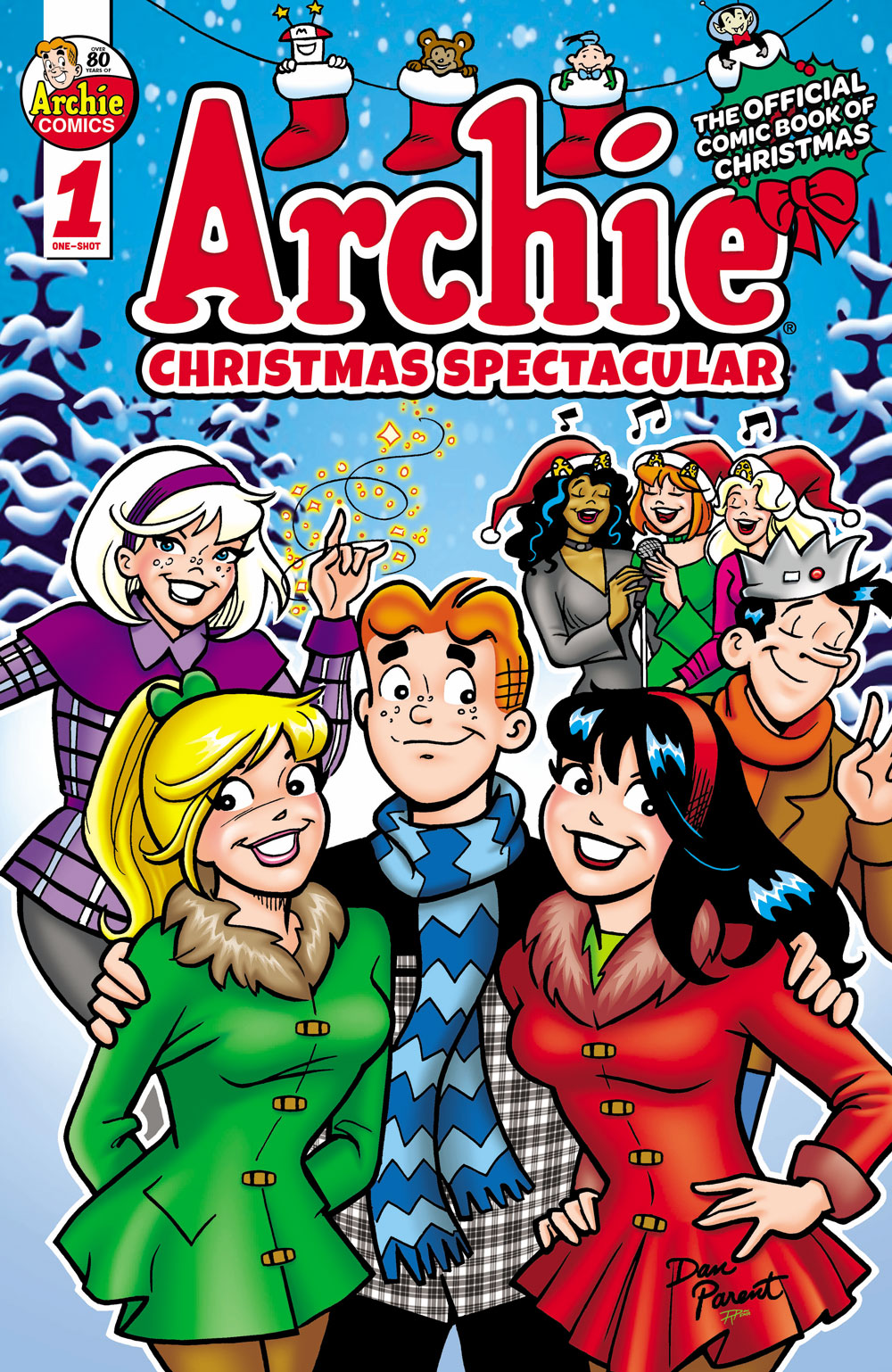 Cover of ARCHIE CHRISTMAS SPECTACULAR. Archie is in the foreground with his arms around Betty and Veronica. Jughead stands behind them waving at the viewer, and Sabrina is next to him casting a magical spell, with sparkles floating around her hand. Behind them all in the background, Josie and the Pussycats are singling Christmas carols. They're in a snowy forest and everyone is wearing winter gear.