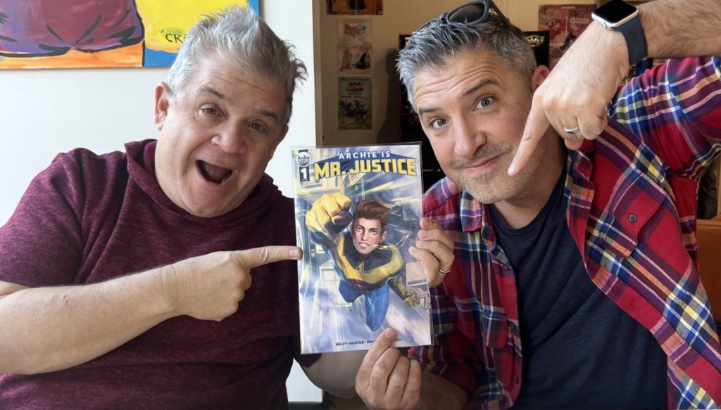 Patton Oswalt and Jordan Blum hold up a copy of Archie Is Mr. Justice #1