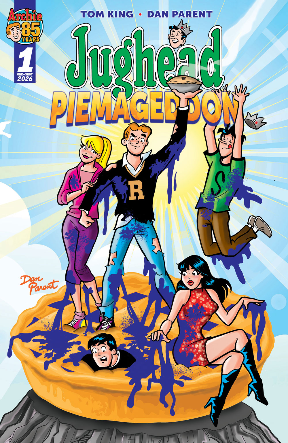 Main cover of JUGHEAD: PIEMAGEDDON by Dan Parent. Archie, Betty, Jughead, Veronica, and Reggie stand and sit on top of a gigantic blueberry pie on a mountaintop, covered in blueberry. Jughead leaps for joy in the background, while Reggie is stuck inside the pie. Archie holds up a smaller pie triumphantly.